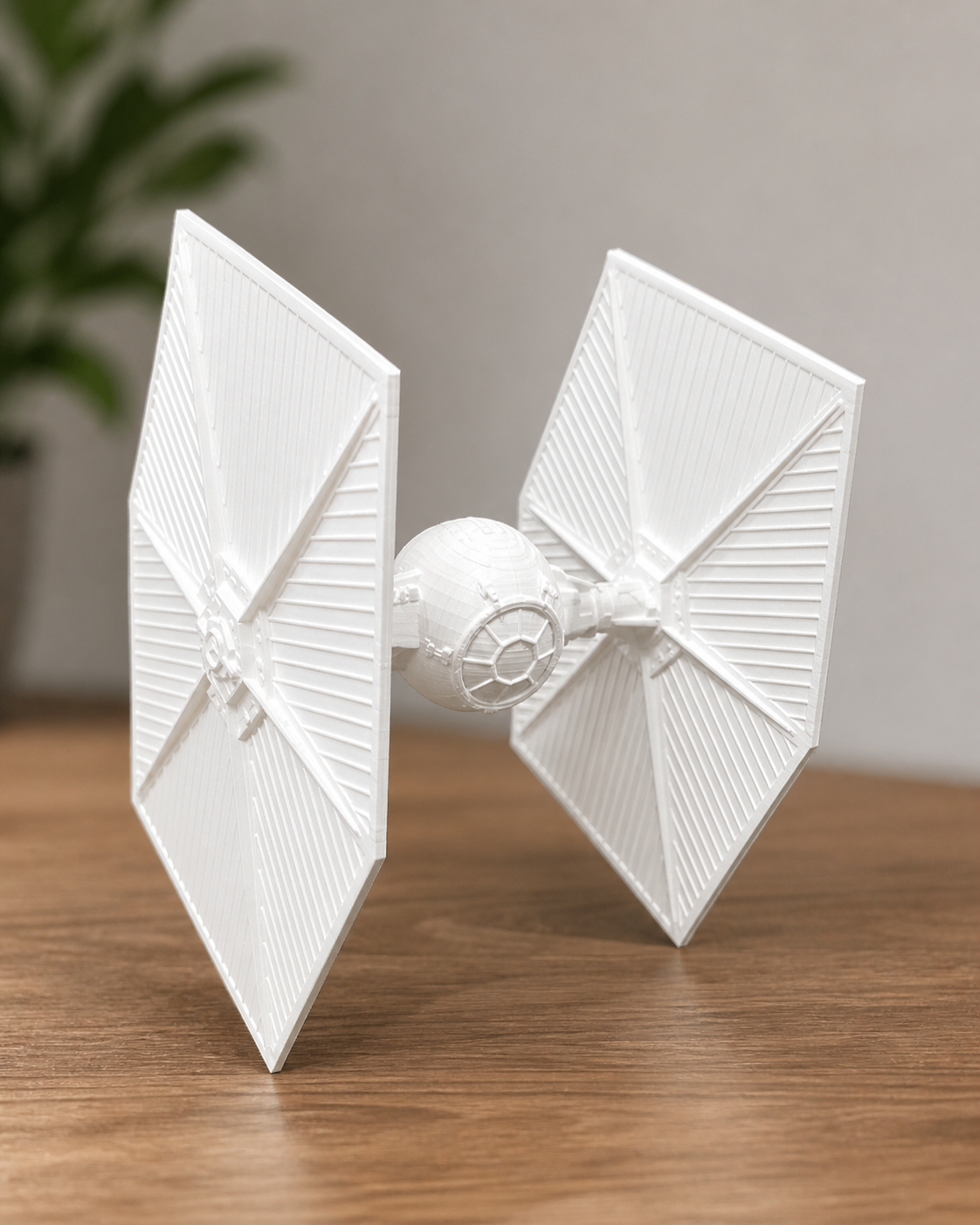 Detailed white TIE Fighter model 3D printed with crisp panel lines